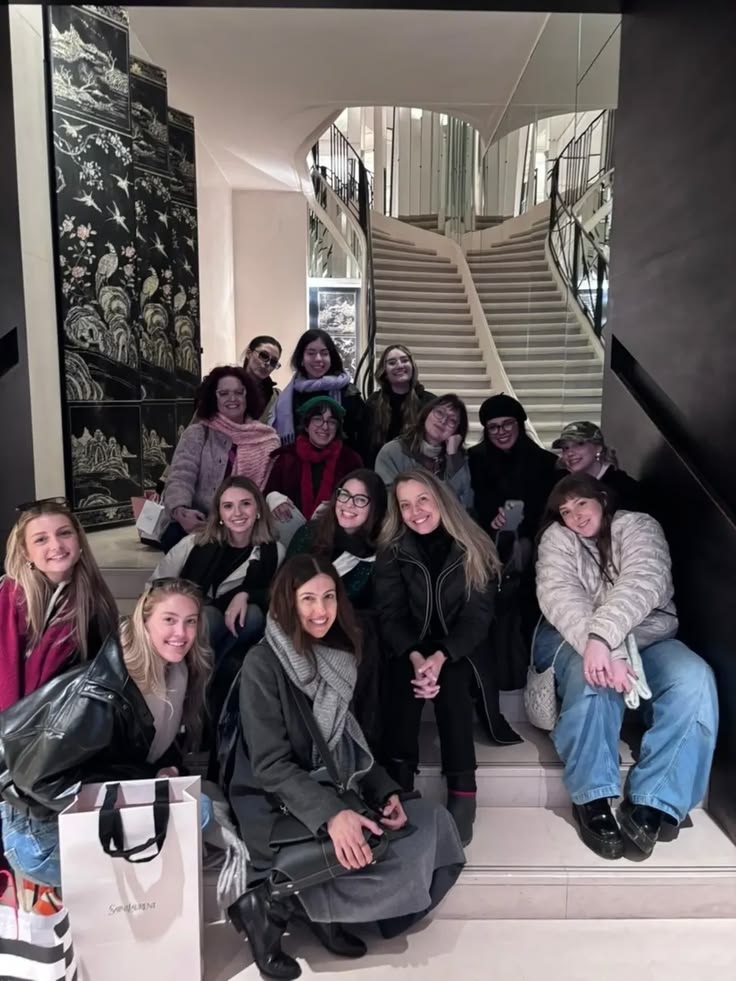 Group of participants of Coolhunting on the road on a white spiral staircase in London